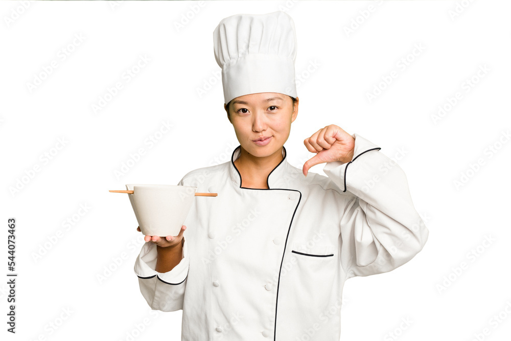 Young chef asian woman holding a bowl of ramen isolated feels proud and self confident, example to follow. Young chef asian woman holding a bowl of ramen isolated feels proud and self confident, example to follow.