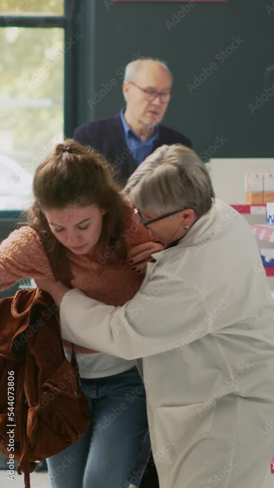 Vertical video Young adult with spinning sensation and dizziness
