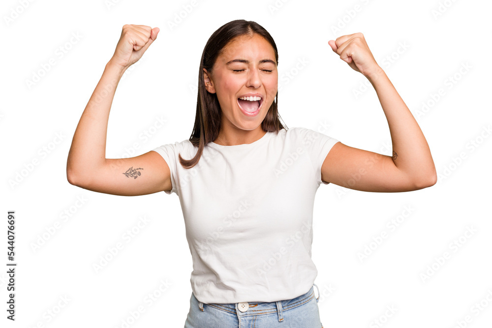 Young cute caucasian woman isolated raising fist after a victory, winner concept. Young cute caucasian woman isolated raising fist after a victory, winner concept.