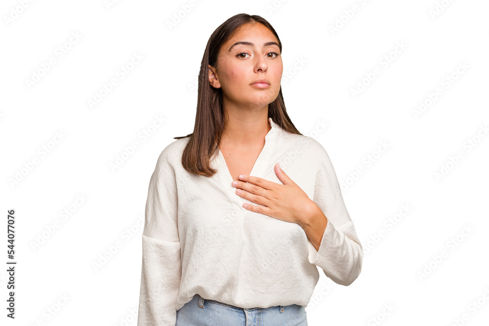 Young cute caucasian woman isolated taking an oath, putting hand on chest. Young cute caucasian woman isolated taking an oath, putting hand on chest.