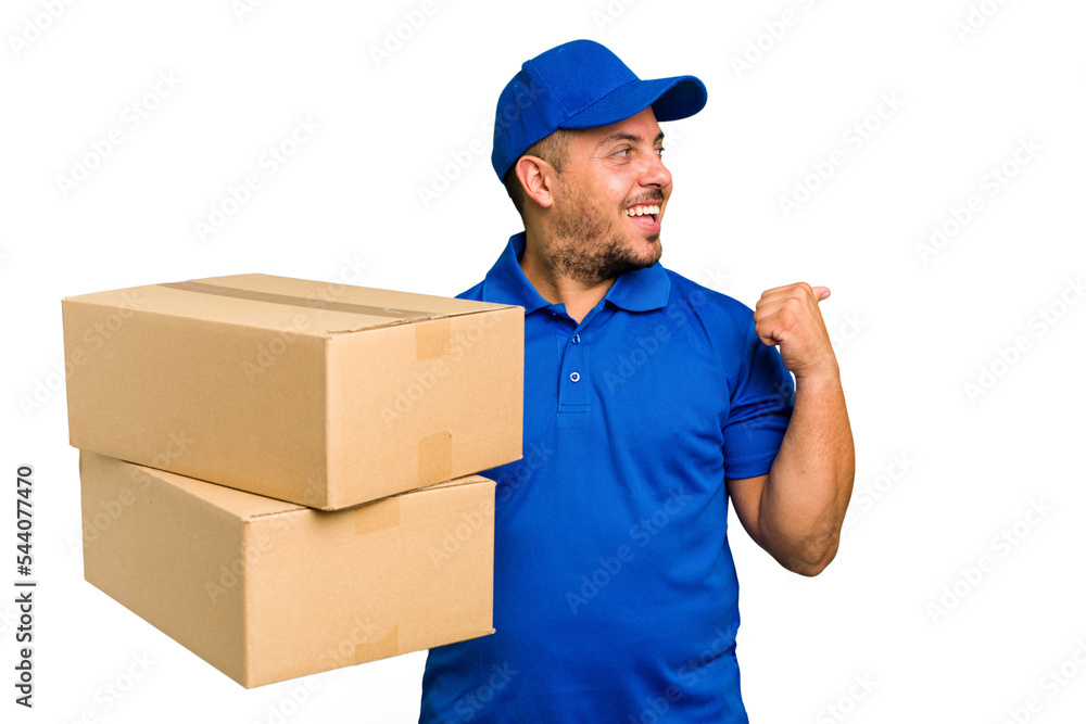Delivery caucasian man isolated points with thumb finger away, laughing and carefree. Delivery caucasian man isolated points with thumb finger away, laughing and carefree.