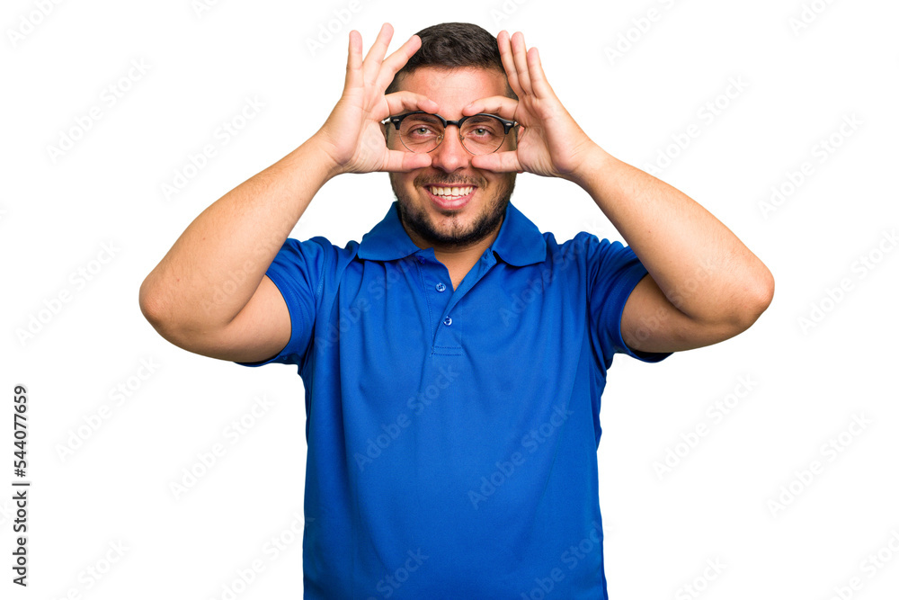 Young caucasian man isolated showing okay sign over eyes Young caucasian man isolated showing okay sign over eyes