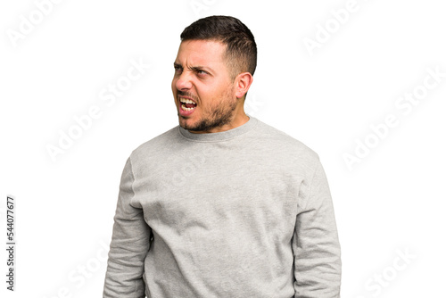 Young caucasian man isolated shouting very angry, rage concept, frustrated.