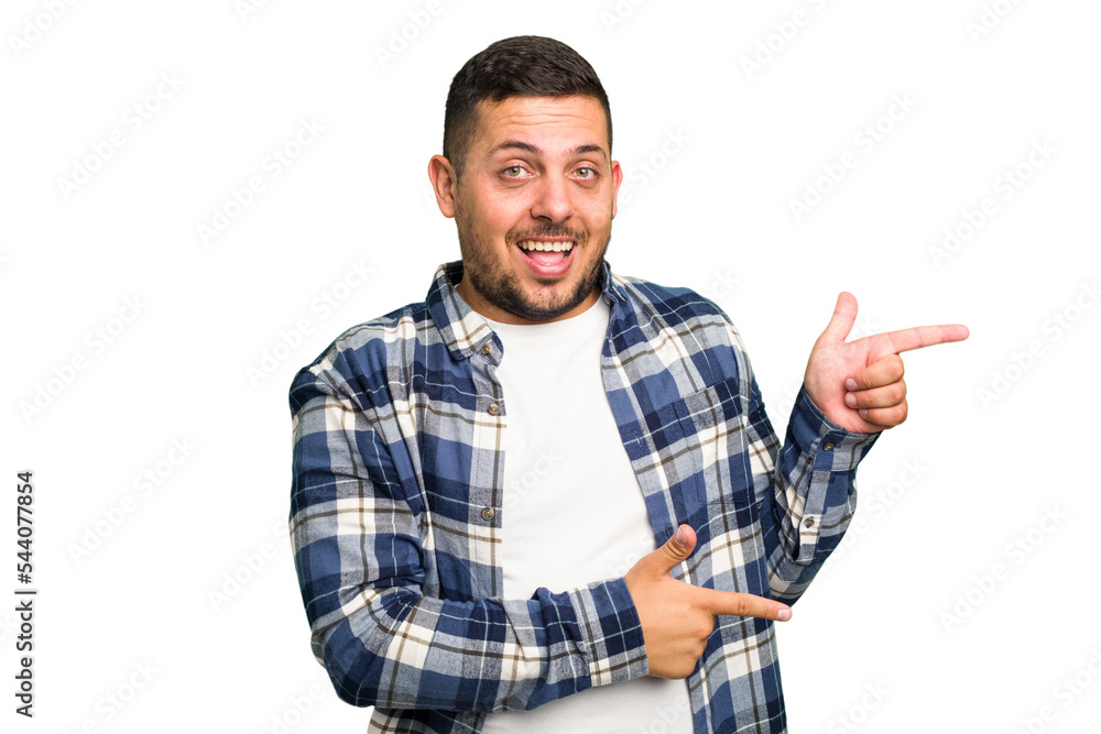 Young caucasian man isolated excited pointing with forefingers away. Young caucasian man isolated excited pointing with forefingers away.