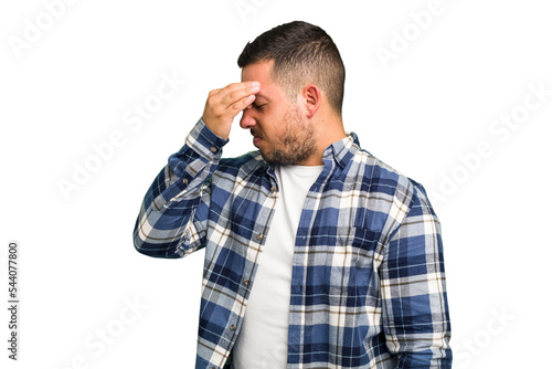 Young caucasian man isolated having a head ache, touching front of the face.