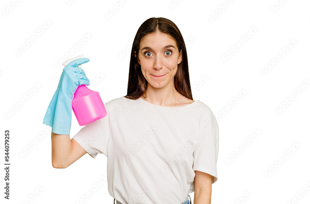 Young cleaner woman isolated shrugs shoulders and open eyes confused. Young cleaner woman isolated shrugs shoulders and open eyes confused.
