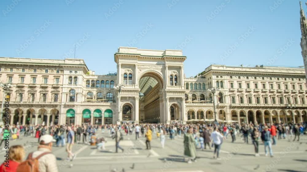 Historical building with arch located near cathedral on crowded central square in Milan. Italian architecture and people on sunny day hyper lapse Historical building with arch located near cathedral on crowded central square in Milan. Italian architecture and people on sunny day hyper lapse