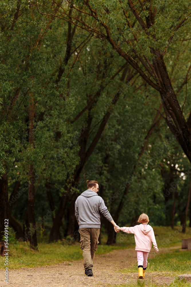 Fototapeta premium Father and daughter walking