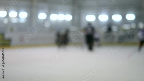 Wallpaper Mural Blurred background. Teams of hockey players playing hockey. Teenage boys play hockey on ice rink at indoor ice stadium. Ice Hockey match championship Sports skating competitions Real professional game Torontodigital.ca