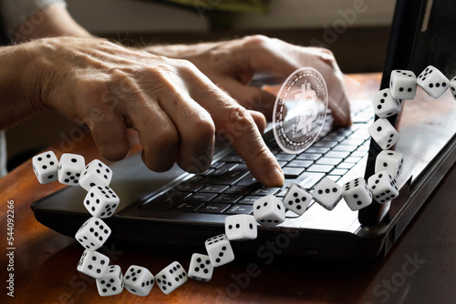 hands on the keyboard keys combined with the image of a chain of dice