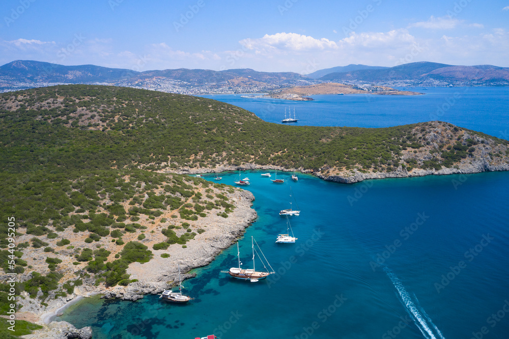 Aerial view of blue sea lagoon and yachts along the mediterranean coast. Landscape of turkish riviera nature