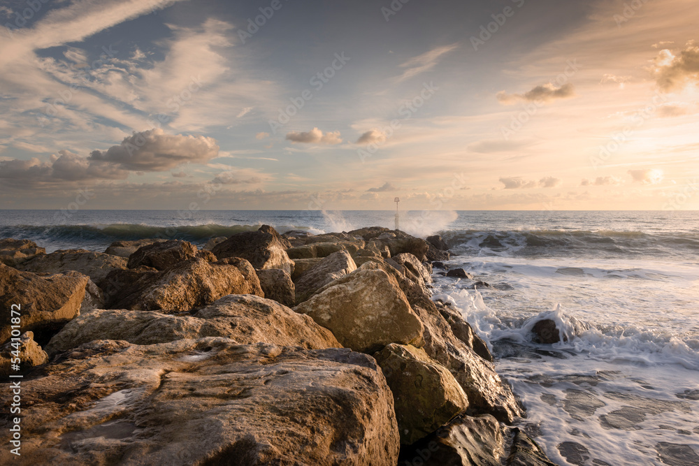 Southbourne Dorset, boulder sea defence with waves, landscape