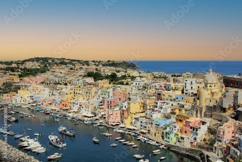 Fototapeta Naklejka Na Ścianę i Meble -  Procida island, Naples, Italy, colorful houses in Marina di Corricella harbour in sunset light
