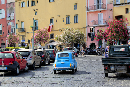 Fotografie Italian little car fiat 500 blue in the streets of Procida Naples in Italy