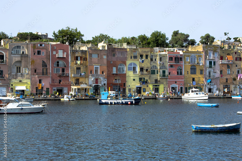 Procida island, Naples, Italy, colorful houses in Marina di Corricella harbour on sunrise light