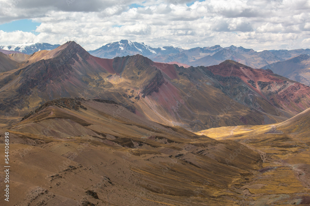 Fototapeta premium Rainbow Mountain Valley, Peru, with views of the mountains. 