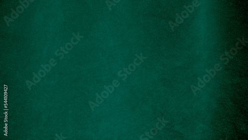 Green velvet fabric texture used as background. Empty green fabric background of soft and smooth textile material. There is space for text. photo