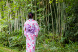 Asian woman with Japanese yukata in countryside