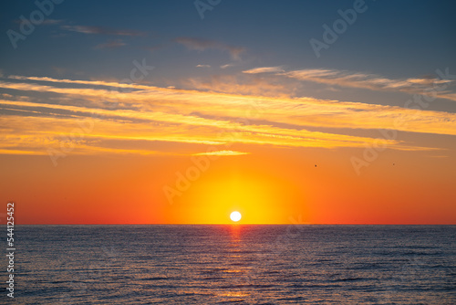Beautiful scenic sunrise over the sea waves © ValentinValkov