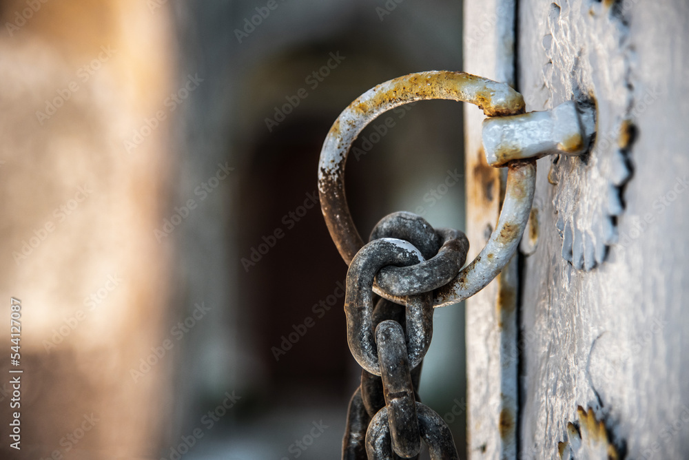 Closeup of part of chain with a ring on the door. Closeup of part of chain with a ring on the door.