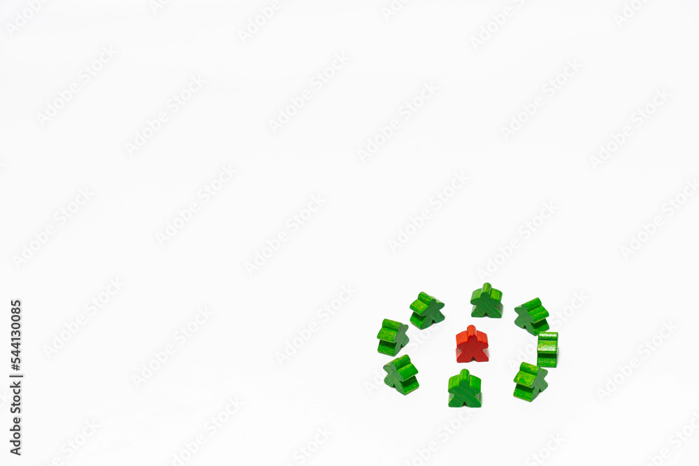 Red meeple is surrounded by green meeples. This can be concept of bully, encircle, odd, special and victim on white background. Red meeple is surrounded by green meeples. This can be concept of bully, encircle, odd, special and victim on white background.