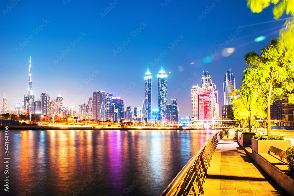 Beautiful incredible cityscape with skyscrapers in the old town next to the Tolerance bridge near the water cana in Dubai, United Arab Emirates.