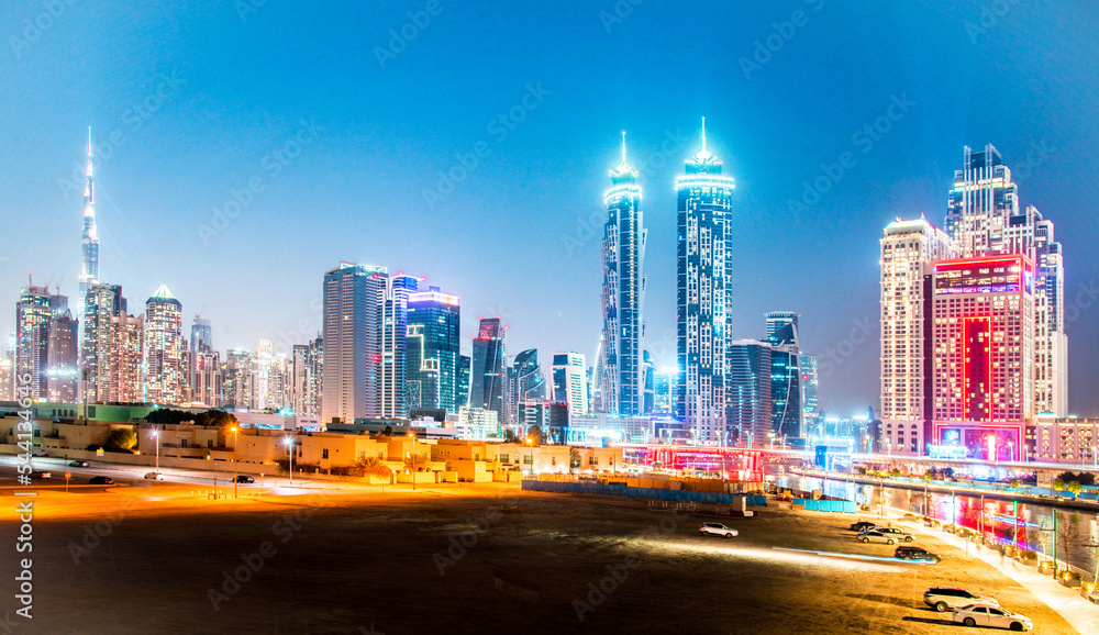 Dubai, United Arab Emirates – February 5, 2021: Beautiful incredible cityscape with skyscrapers in the old town next to the Tolerance bridge near the water canal.