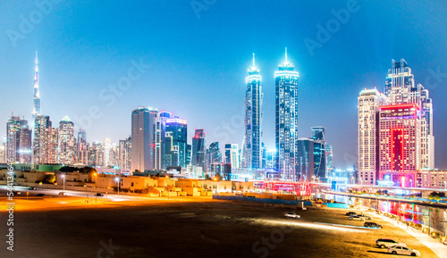 Obraz na płótnie Dubai, United Arab Emirates – February 5, 2021: Beautiful incredible cityscape with skyscrapers in the old town next to the Tolerance bridge near the water canal. w salonie
