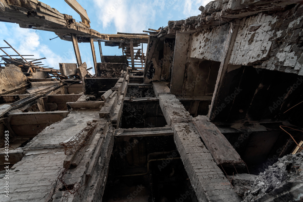 destroyed and burned houses in the city during the war in Ukraine