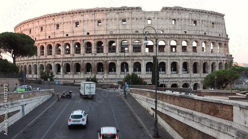 Time lapse Colosseum (Coliseum or Colosseo) in Rome, Italy. Ancient ruins of Flavian Amphitheatre. Arena for gladiator fightings. World famous landmark and very popular touristic destination for vacat photo
