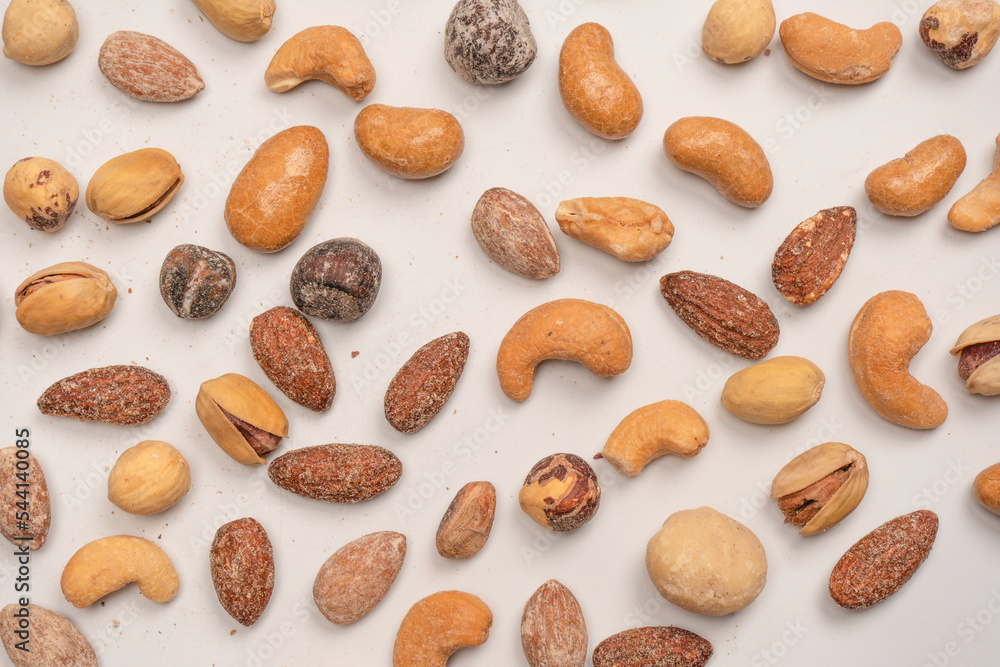 A group of almonds, pistachios, walnuts, macadamia, cashews. A group of almonds, pistachios, walnuts, macadamia, cashews.