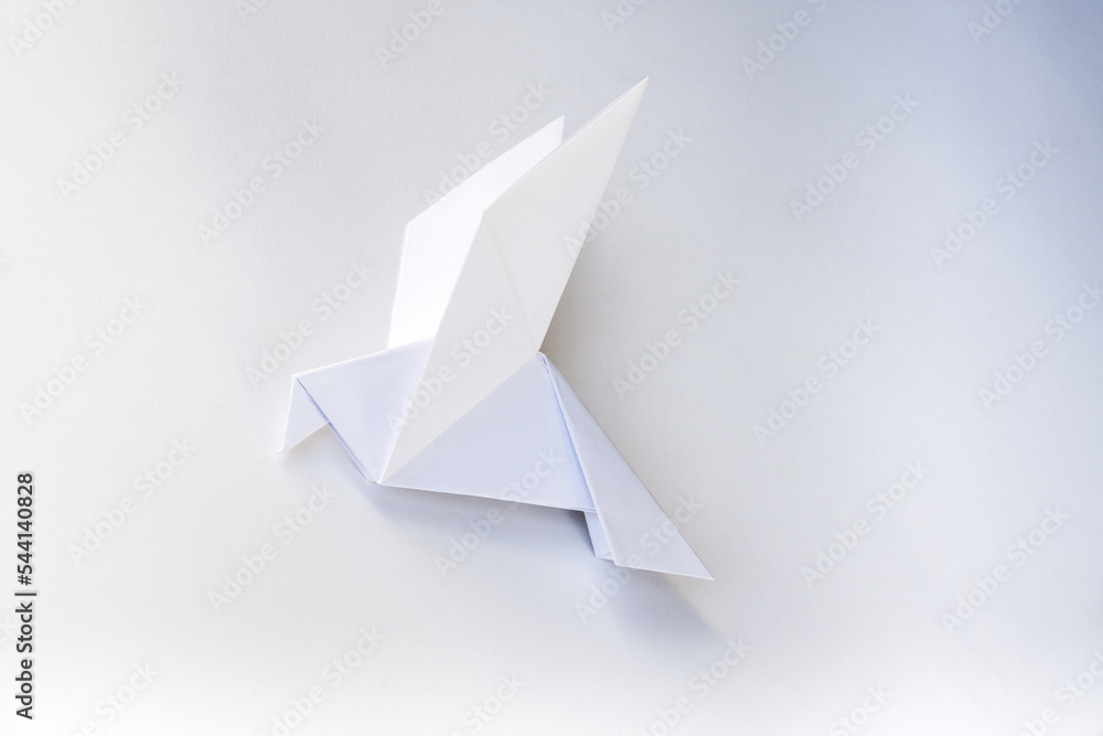 Paper dove origami isolated on a white background Paper dove origami isolated on a white background