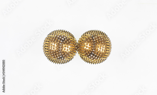 golden massage balls with spikes isolated on white background
