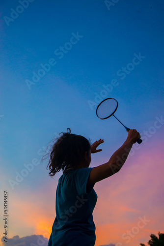 badminton player gestures outdoor silhouette © yongyut