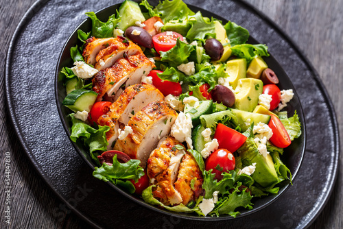 Mediterranean grilled Chicken Salad in black bowl