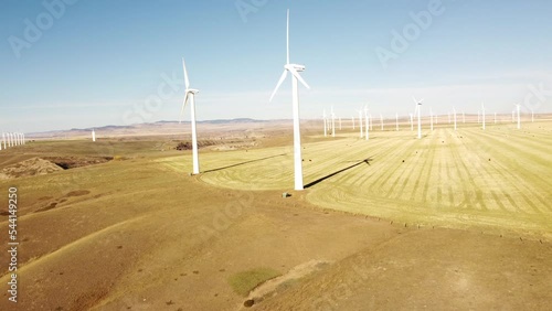 Pincher Creek Alberta Canada, October 16 2022: Aerial Vestas wind mills on a wind farm producing net zero emissions on prairie fields.
 photo