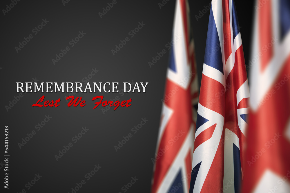 Obraz premium Flag of Great Britain with Text on dark gray background. Holidays of the UK. Remembrance Day.