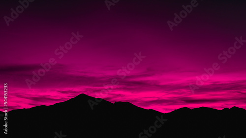 Dramatic Bold Pink Sunset Mountain Silhouette over the Mazatzal Peak in Tonto National Forest near Phoenix, Arizona photo