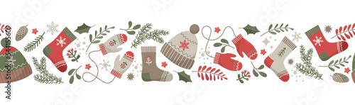 Winter border with cute and cozy elements. Christmas seamless pattern. Banner. Vector background with woolen socks, hat, mittens, winter forest foliage, snowflakes and stars