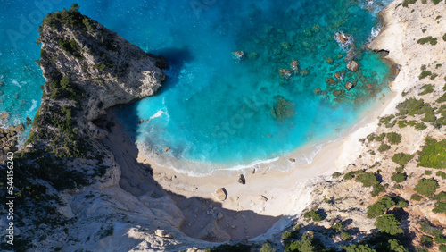 Aerial drone photo of steep white cliffs in secluded paradise beach in Northern part of Kefalonia island, Ionian ,Greece © aerial-drone