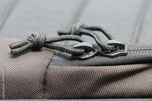 Double Zipper close up view from a camera holder bag on a natural light