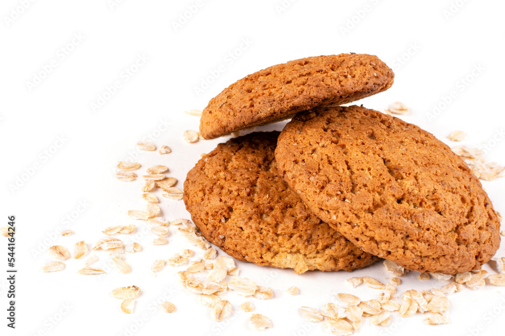 Three round oatmeal cookies on a white isolated background. Healthy pastries, proper nutrition. Space for text. Template for the design. Three round oatmeal cookies on a white isolated background. Healthy pastries, proper nutrition. Space for text. Template for the design.