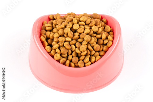 Pink bowl with dry food for a cat (dog) on a white isolated background. Template for the design. Balanced nutrition of pets.