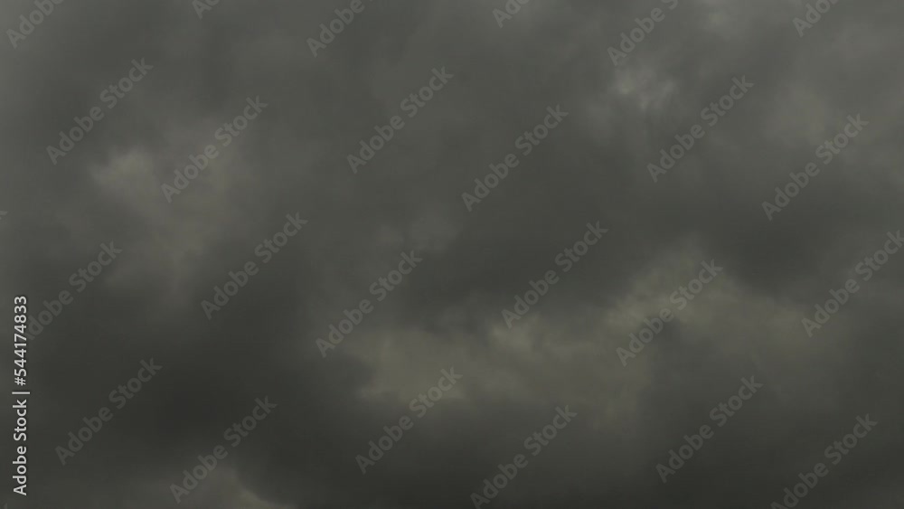 4K timelapse stratocumulus dark grey rolling clouds opening a bit of blue sky 4K timelapse stratocumulus dark grey rolling clouds opening a bit of blue sky