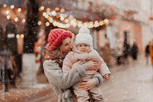 young mother with baby in christmas holidays, winter concept, happy holiday family