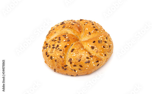 Traditional white kaiser roll with linseeds and sesame seeds isolated on white background photo