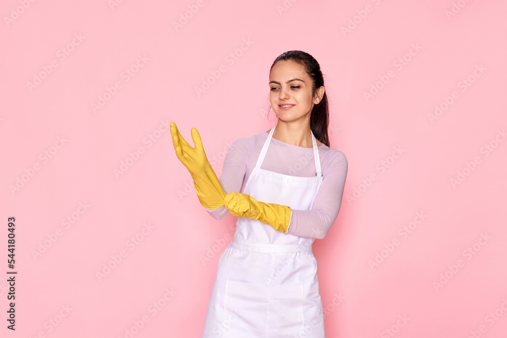 woman in gloves and cleaner apron showing ok sign woman in gloves and cleaner apron showing ok sign