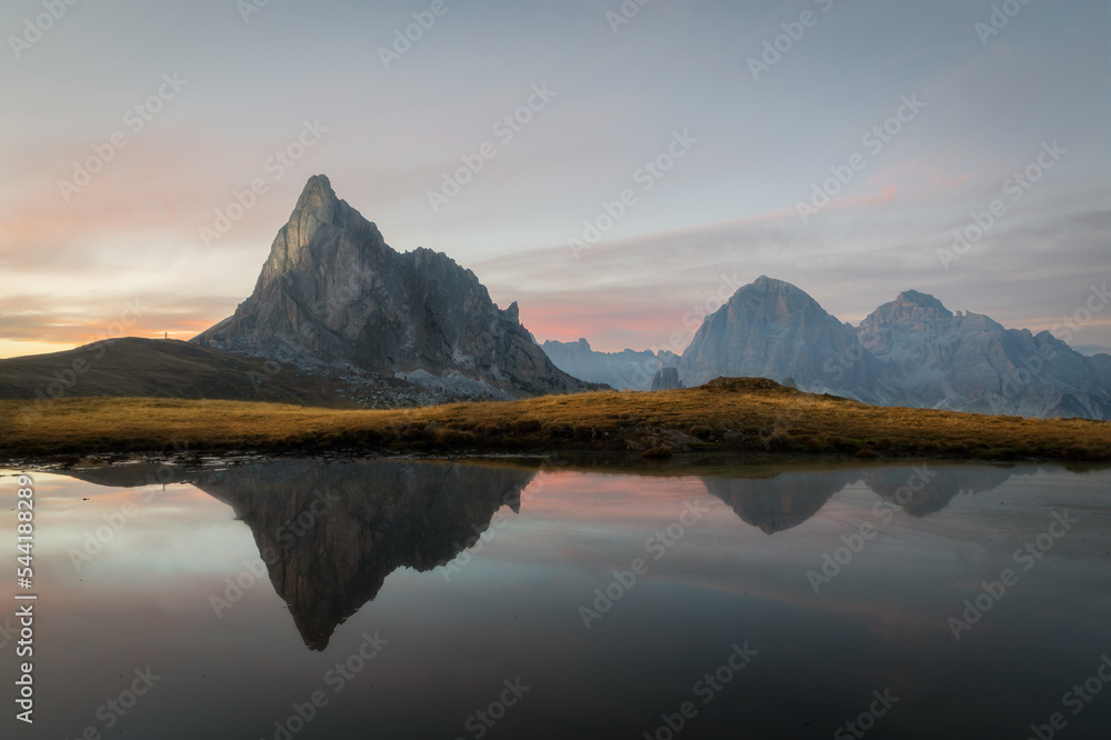 sunset with mountain reflected - passo giau - cortina d'ampezzo - italy 