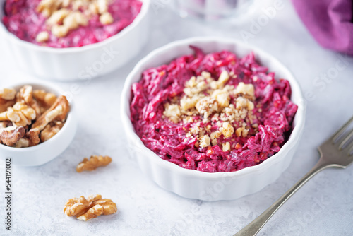 Beetroot mayonnaise salad with walnuts in a bowl