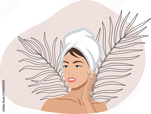 Portrait of a woman with a towel on her head